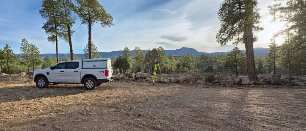 Surveying equipment at a land survey site in a natural mountainous area for accurate land measurement with Jones Land Surveying LLC.